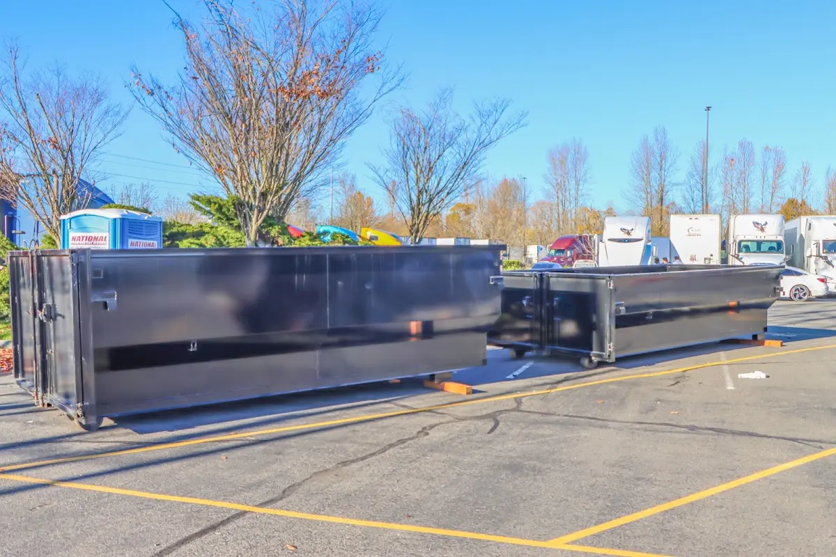 Professional dumpster rental service with roll-off container on residential driveway in Chillicothe